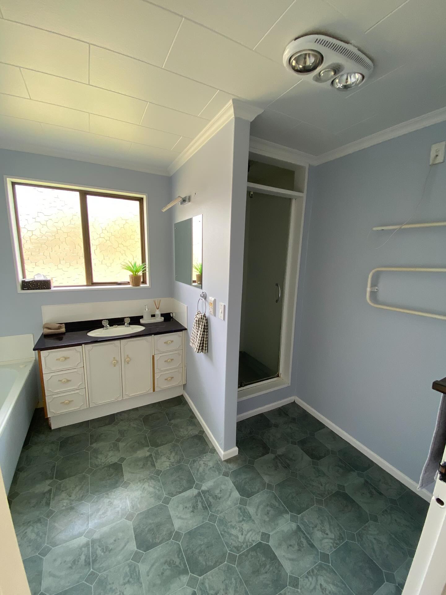 Kitchen Before Renovation - Dated cabinets and worn surfaces